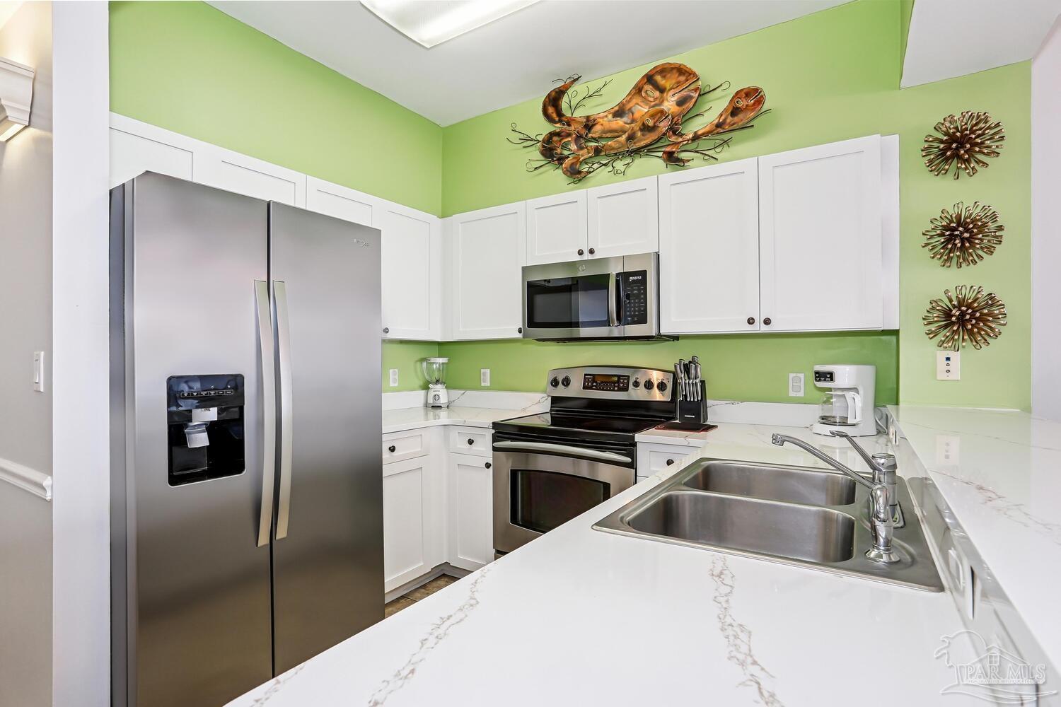 14511 Perdido Key Drive, Unit 1303 Perdido Key, FL 32507 - Photo 5 of 58 a kitchen with a refrigerator sink and microwave