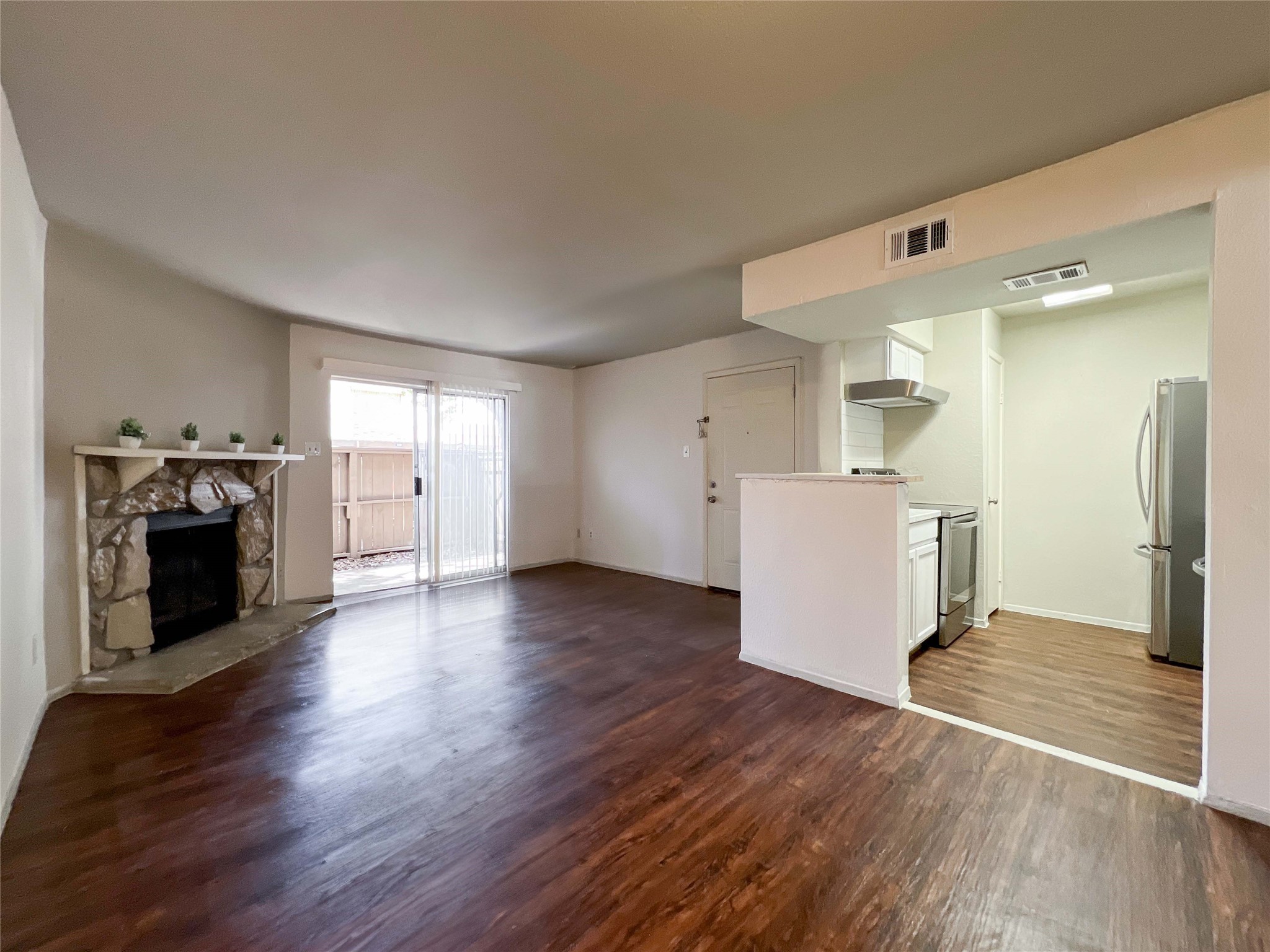 6001 Reims Road, Unit 1207 Houston, TX 77036 - Photo 2 of 18 a view of a kitchen with a sink and a stove top oven