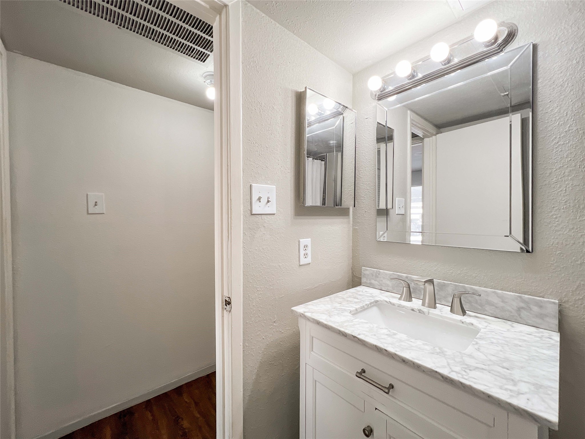 6001 Reims Road, Unit 1207 Houston, TX 77036 - Photo 7 of 18 a bathroom with a granite countertop sink and a mirror