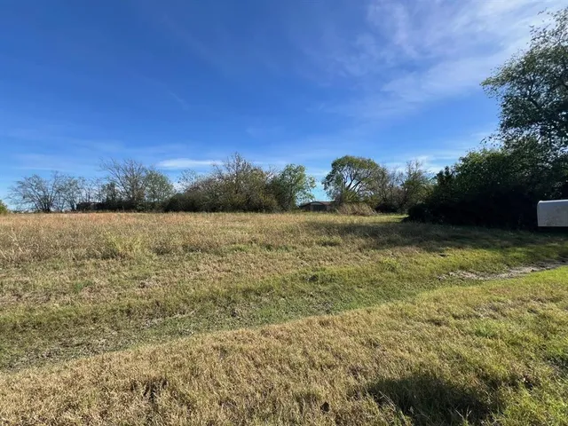 a view of a lake with a yard