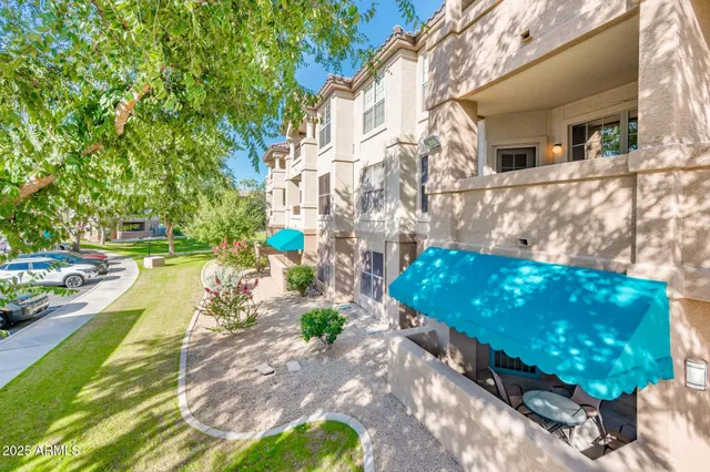 a view of a backyard with sitting area