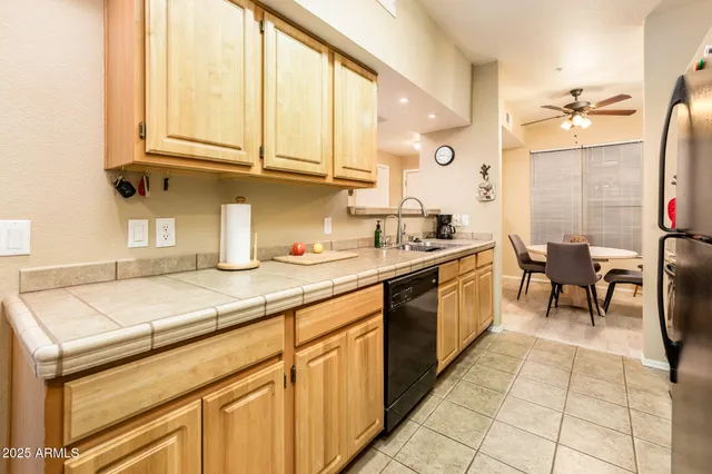 a kitchen with stainless steel appliances granite countertop a sink and cabinets