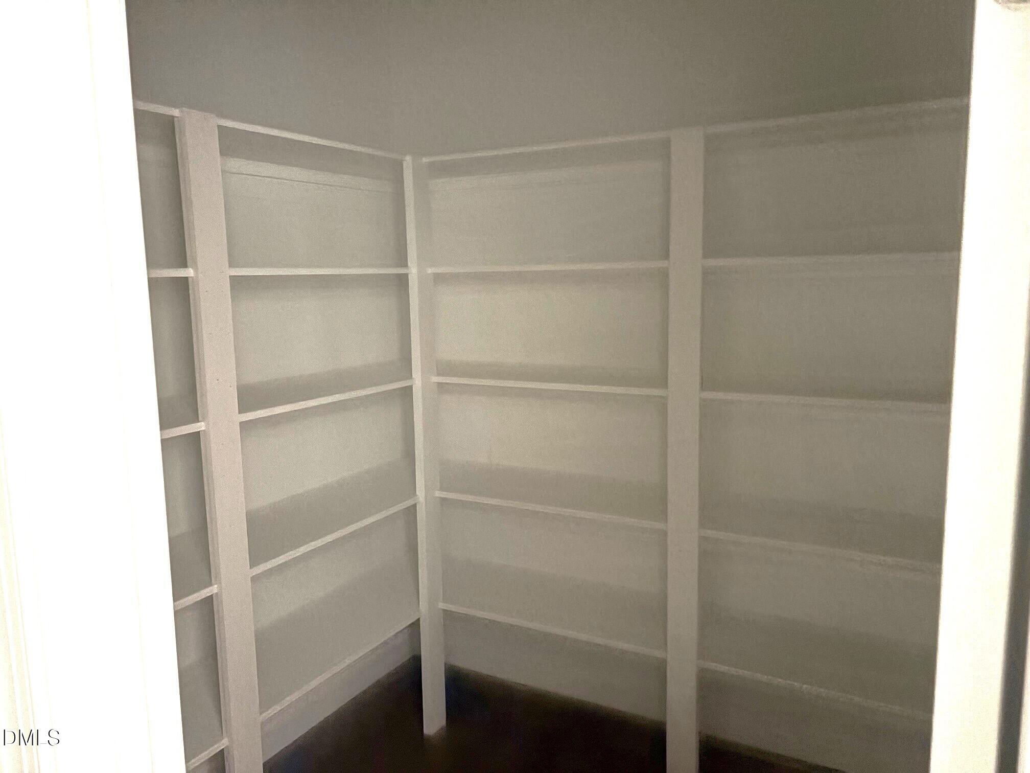 7 East Victoria Ridge Drive, Unit 16 Selma, NC 27576 - Photo 13 of 45 a view of walk in closet with empty racks