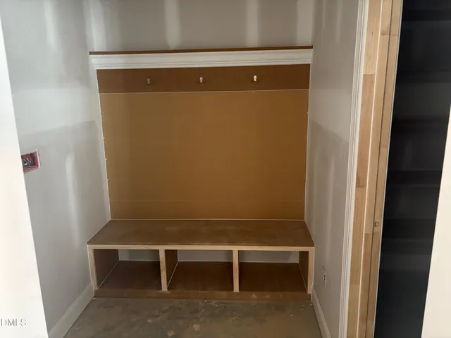 a kitchen with kitchen island granite countertop a sink a counter space appliances and cabinets