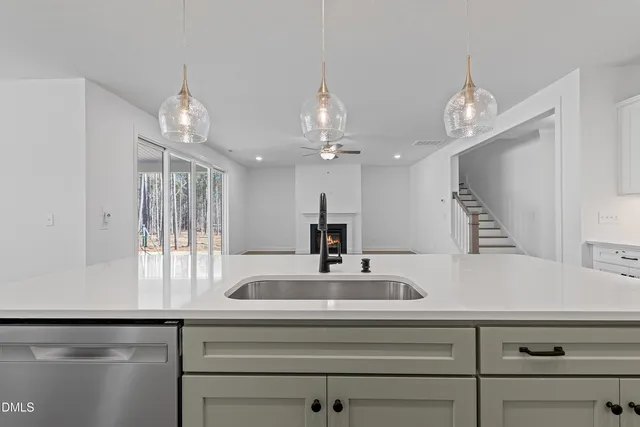 a bathroom with a granite countertop sink a toilet and a large mirror