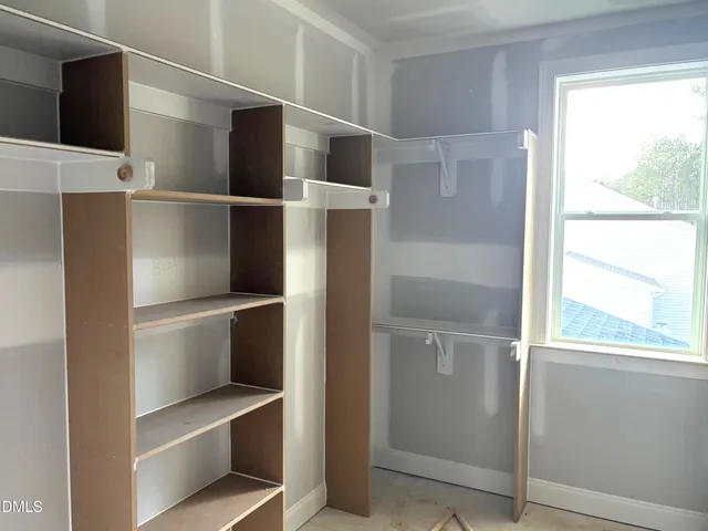 a spacious bathroom with a double vanity sink shower and a mirror