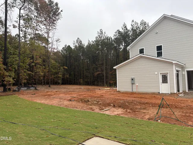 a view of empty room with large trees