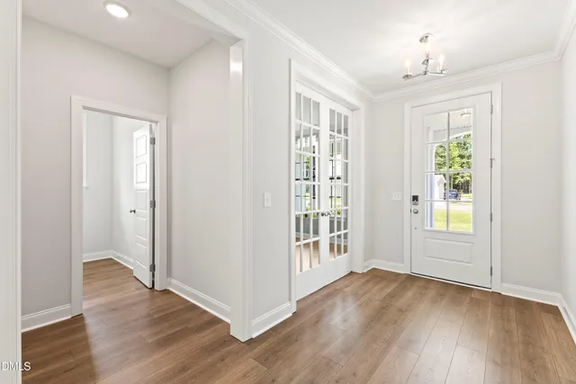 a bathroom with a shower and a glass door