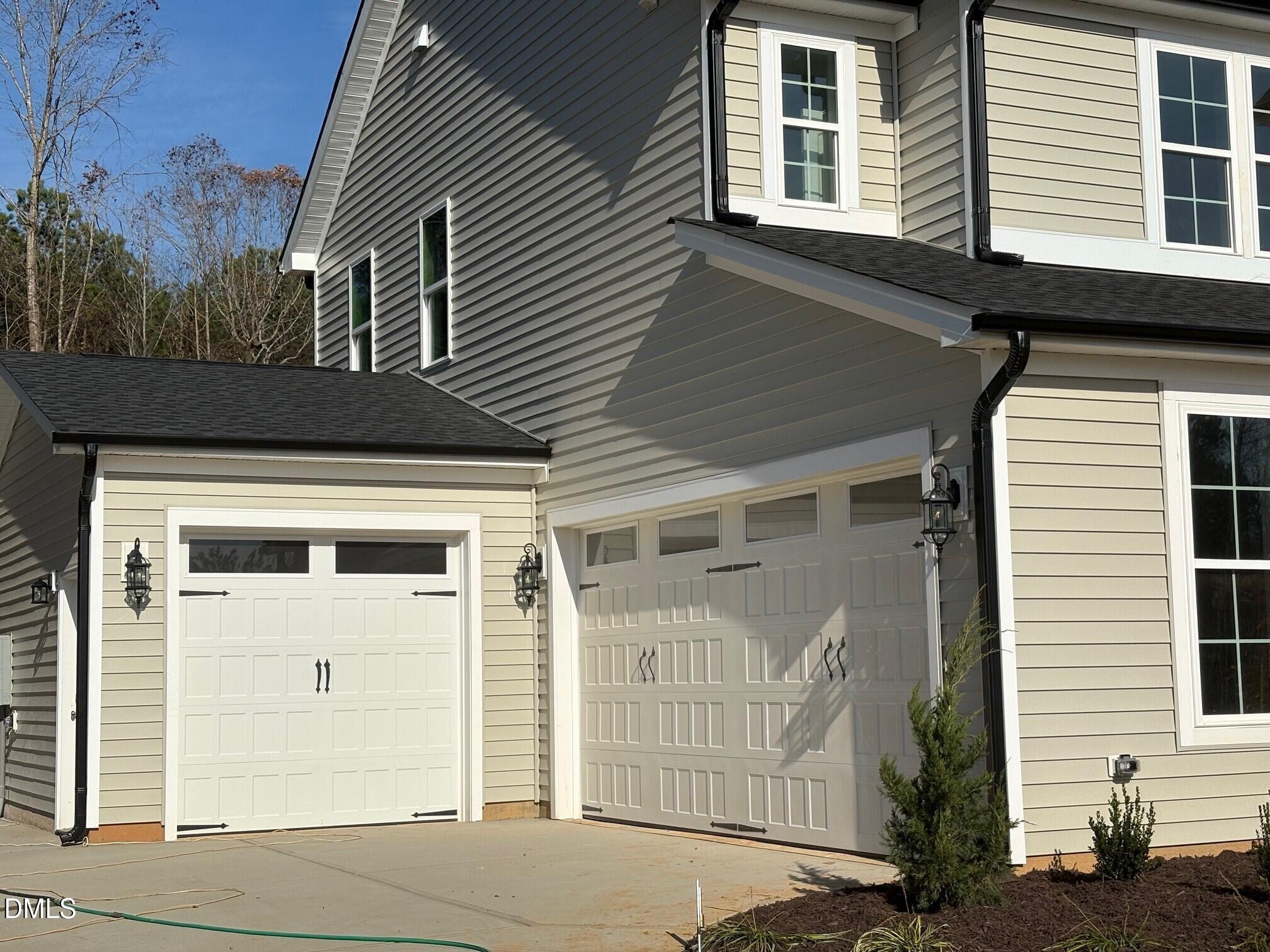 7 East Victoria Ridge Drive, Unit 16 Selma, NC 27576 - Photo 3 of 45 a front view of a house with a garage