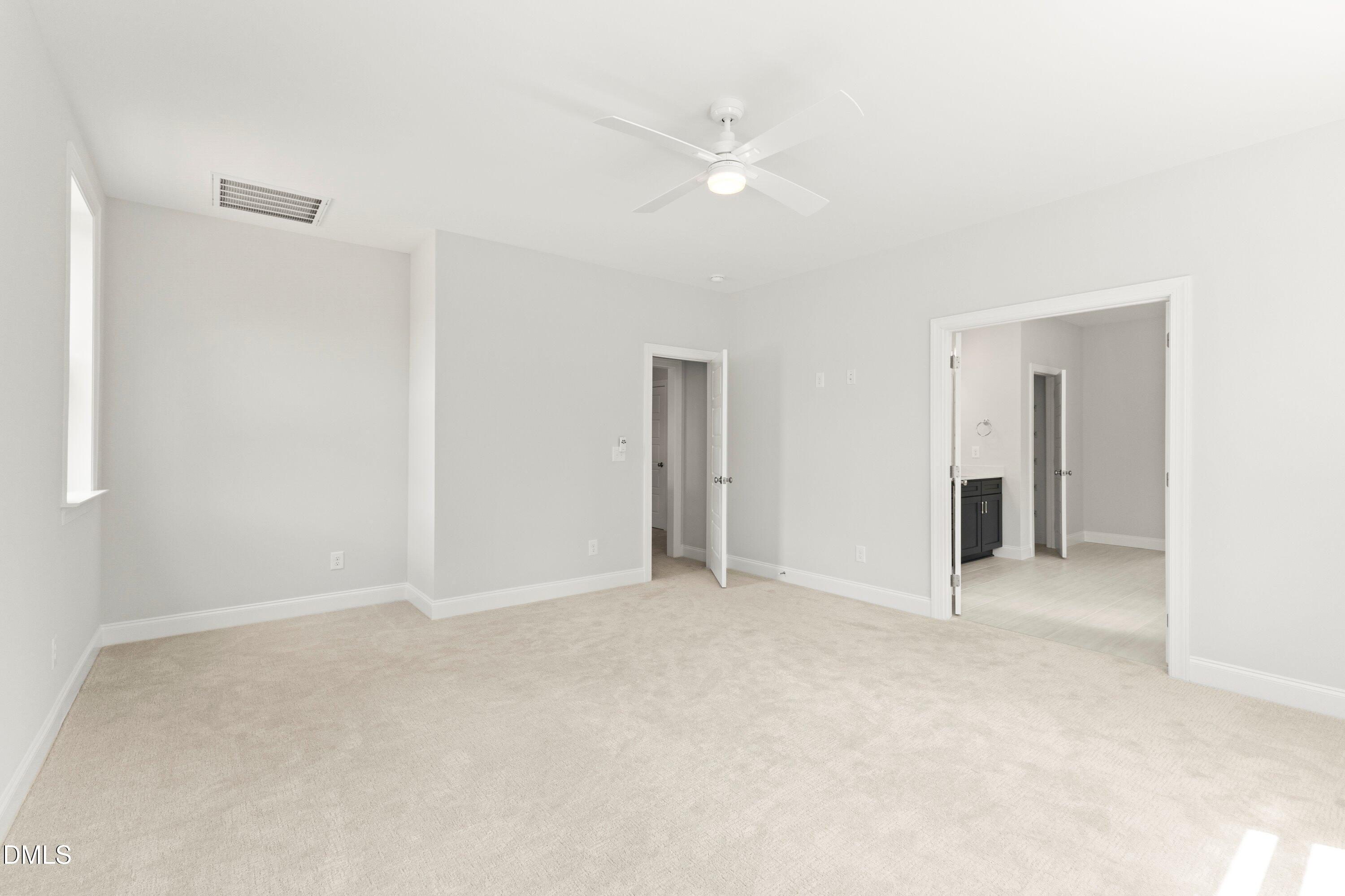 7 East Victoria Ridge Drive, Unit 16 Selma, NC 27576 - Photo 34 of 45 a view of an empty room with a ceiling fan