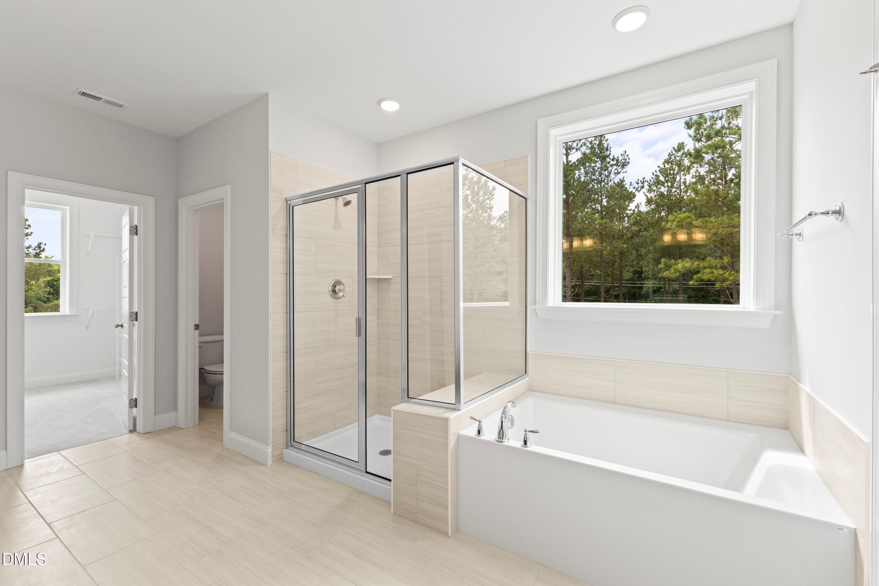 7 East Victoria Ridge Drive, Unit 16 Selma, NC 27576 - Photo 36 of 45 a bathroom with a bathtub and a shower