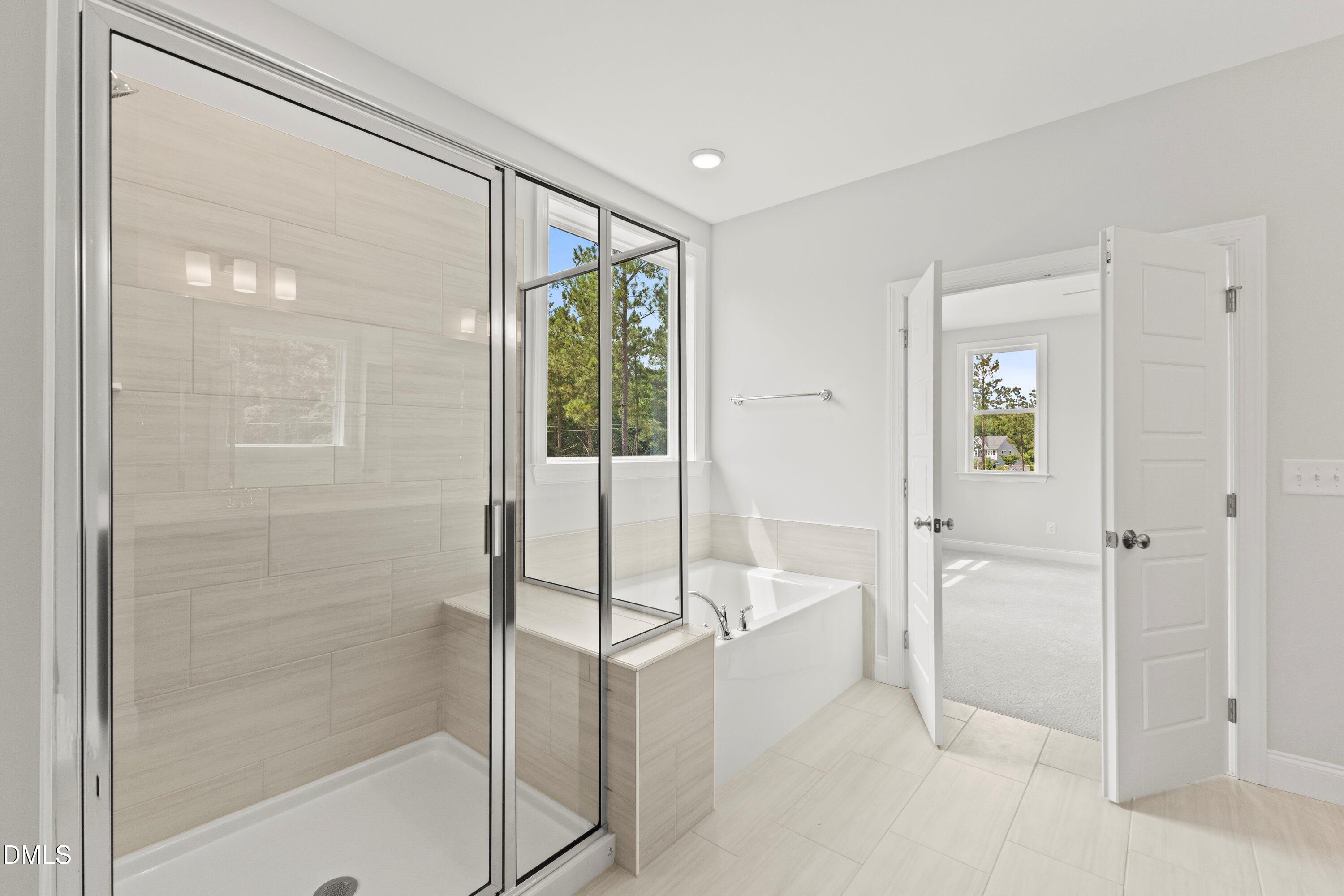 7 East Victoria Ridge Drive, Unit 16 Selma, NC 27576 - Photo 37 of 45 a bathroom with a shower and a glass door