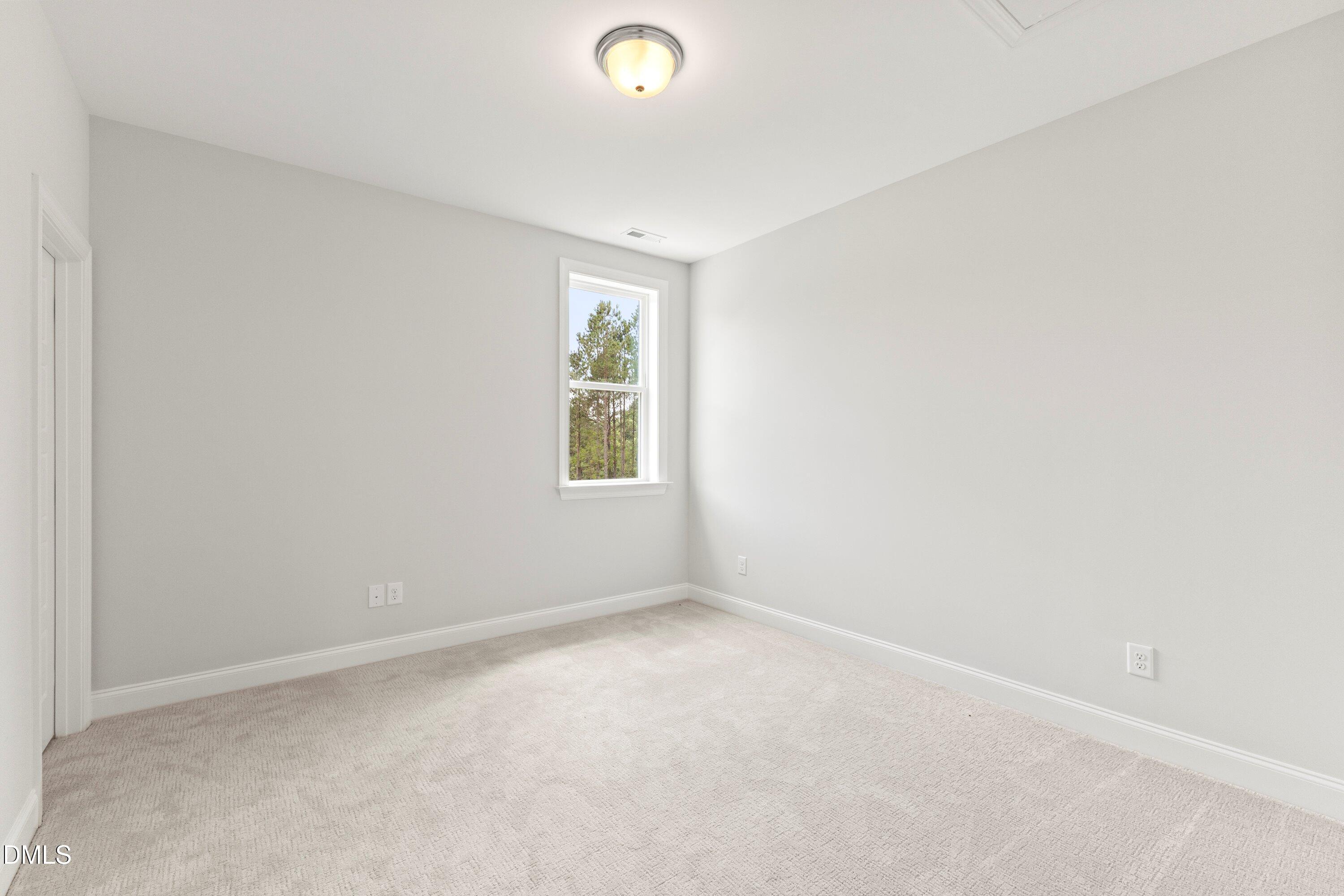 7 East Victoria Ridge Drive, Unit 16 Selma, NC 27576 - Photo 42 of 45 an empty room with a window