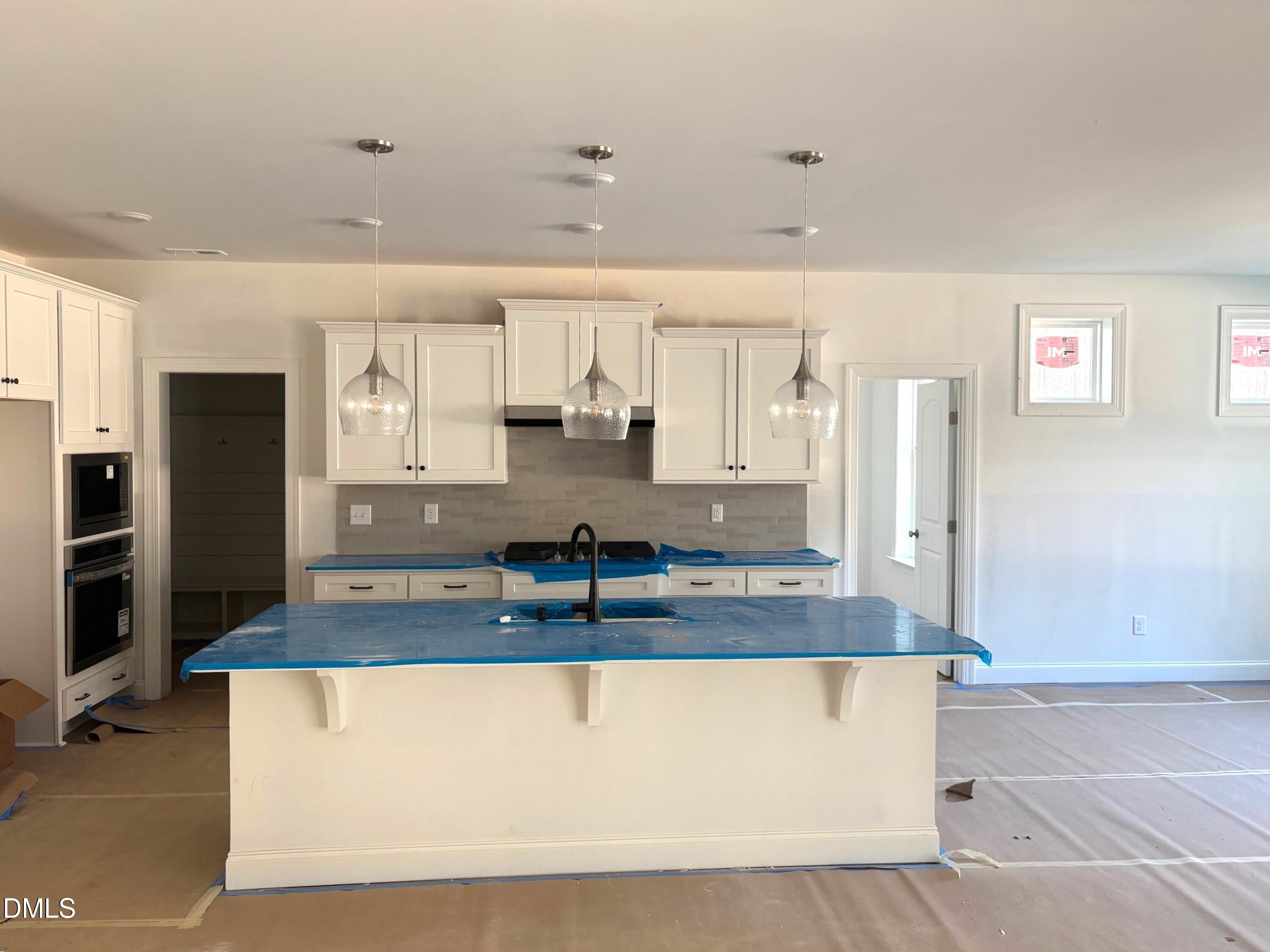7 East Victoria Ridge Drive, Unit 16 Selma, NC 27576 - Photo 7 of 45 a large kitchen with stainless steel appliances granite countertop a granite counter tops and a refrigerator