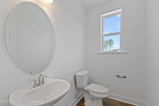 a kitchen with kitchen island granite countertop a sink cabinets and stainless steel appliances