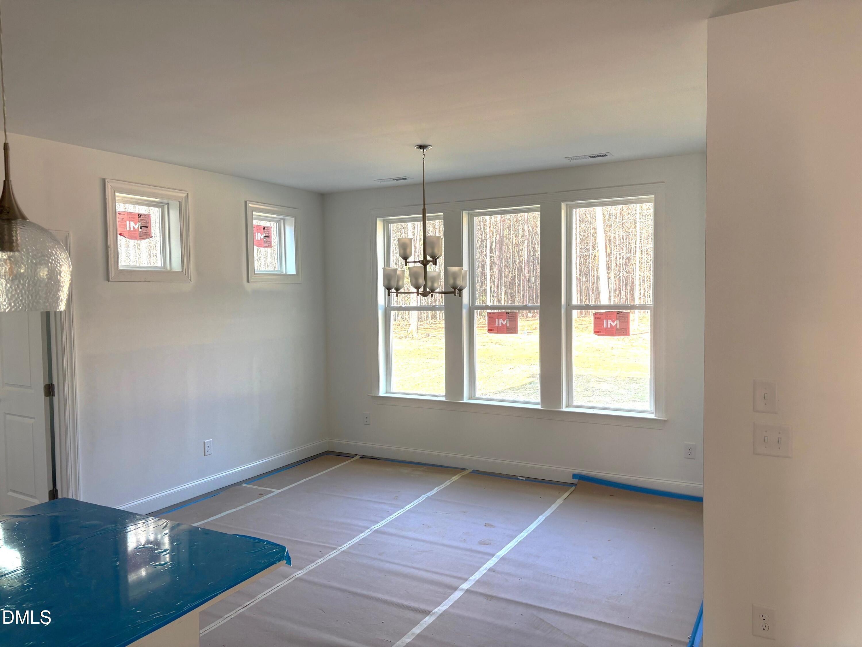 7 East Victoria Ridge Drive, Unit 16 Selma, NC 27576 - Photo 9 of 45 a view of an empty room with a window