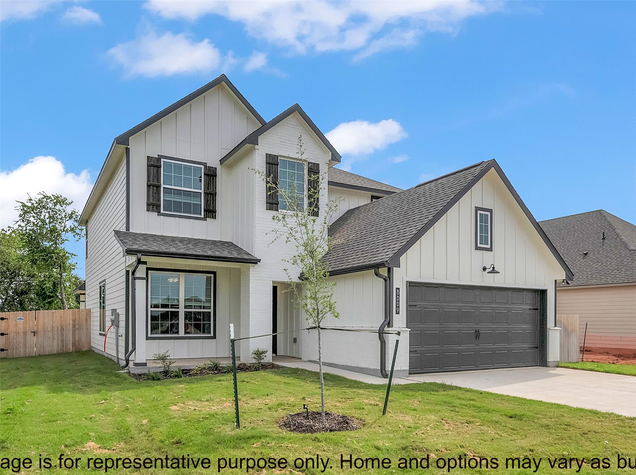 246 Gus Loop Georgetown, TX 78626 - Photo 2 of 9 View of front of home featuring board and batten siding, roof with shingles, and concrete driveway