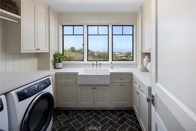 a bathroom with a sink a vanity and a large mirror