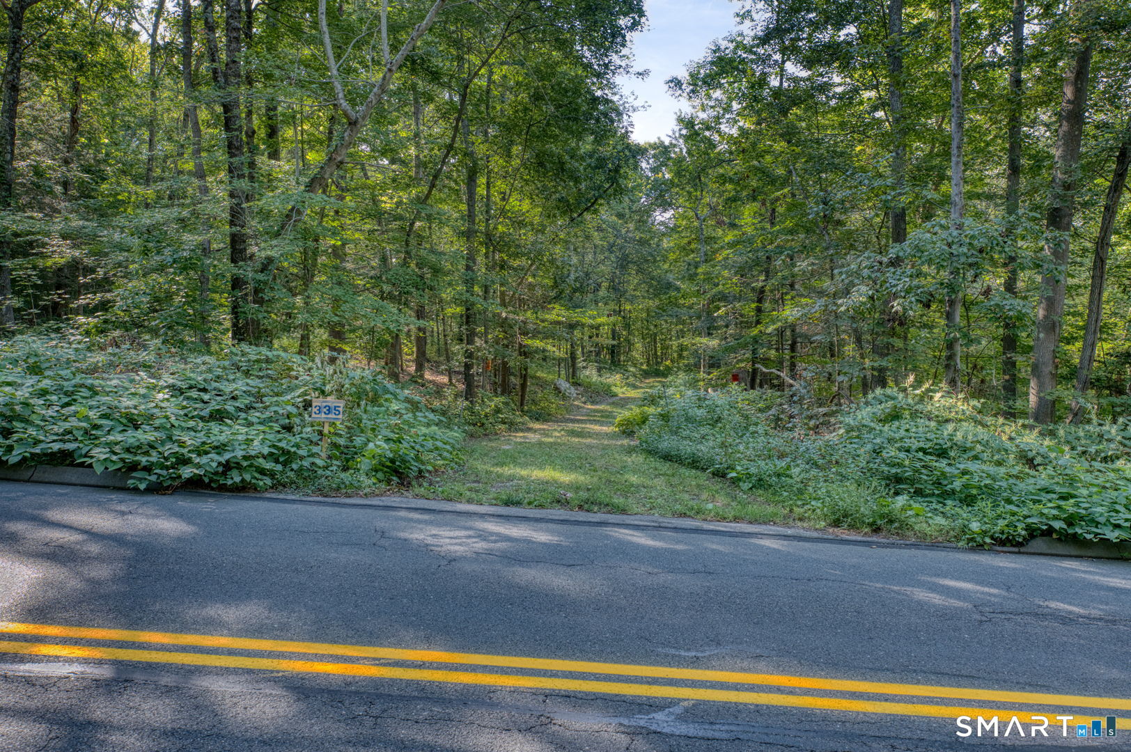 335 Old Post Road Tolland, CT 06084 - Photo 4 of 13 Road frontage providing access to the property.