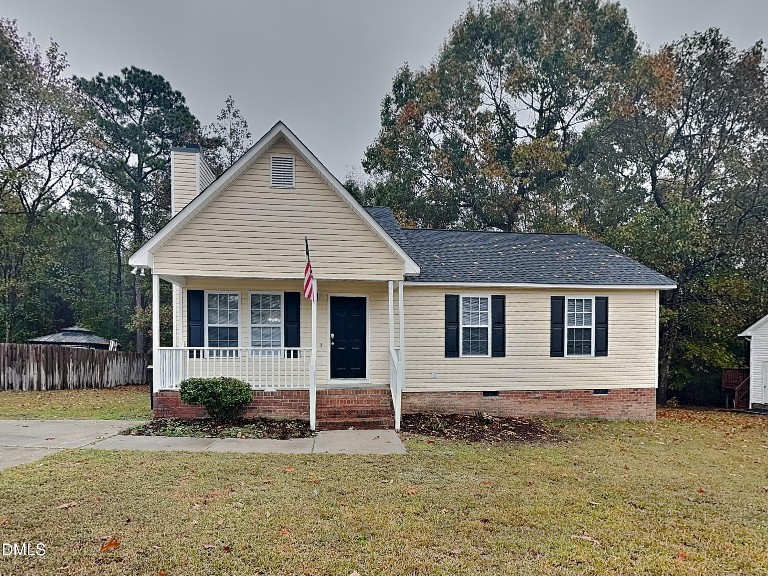 1017 Laurel Leaf Road Zebulon, NC 27597 - Photo 1 of 16 front view of a house with a yard