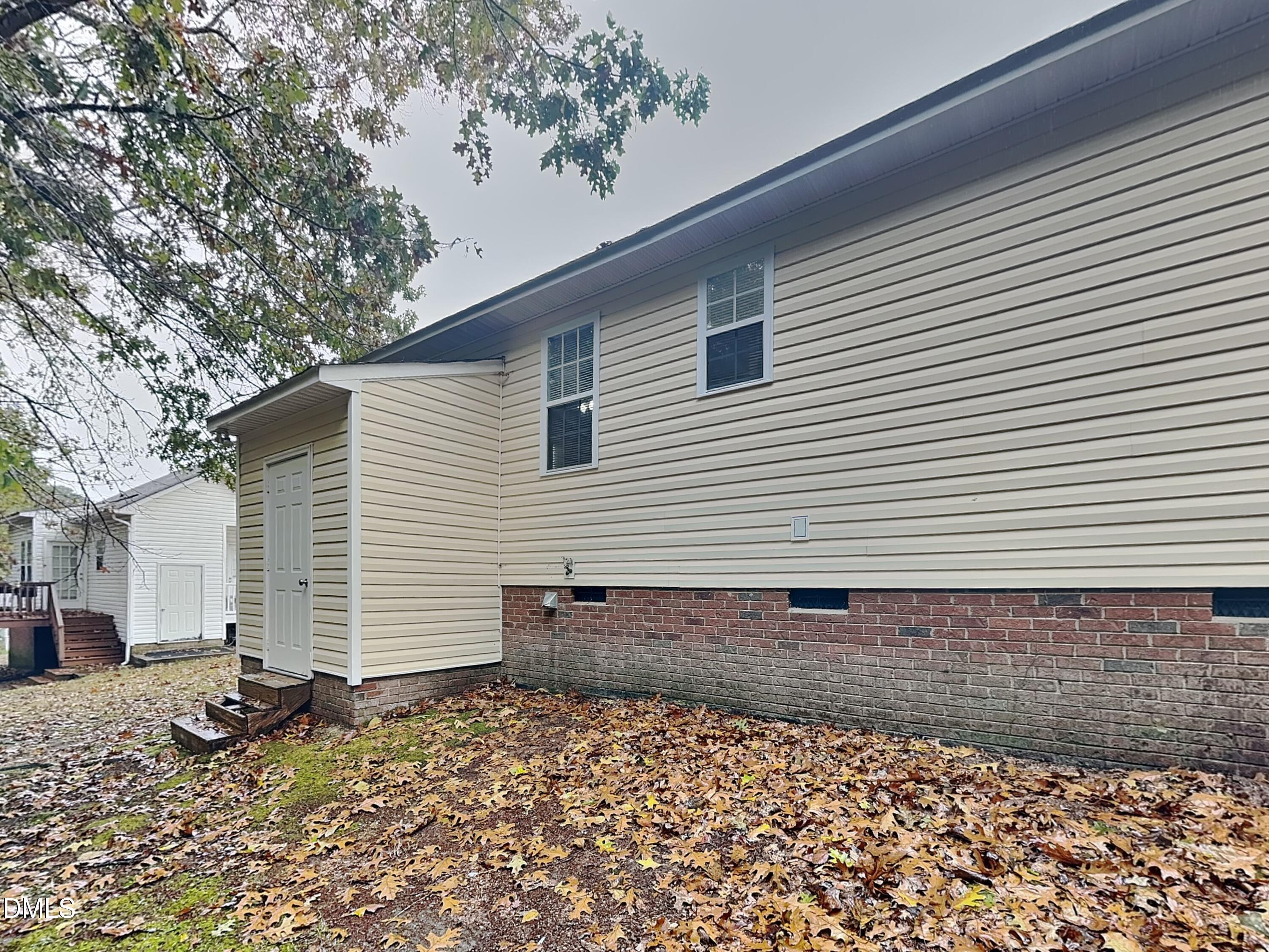 1017 Laurel Leaf Road Zebulon, NC 27597 - Photo 16 of 16 a backyard of a house