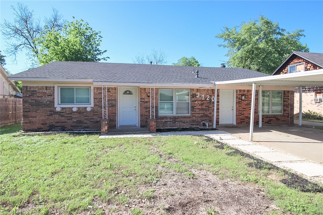 front view of a house with a yard