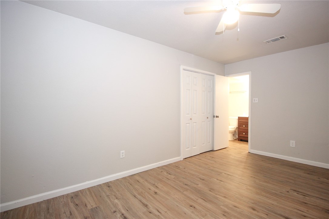 3720 Wingate Drive Waco, TX 76706 - Photo 13 of 18 an empty room with wooden floor and windows