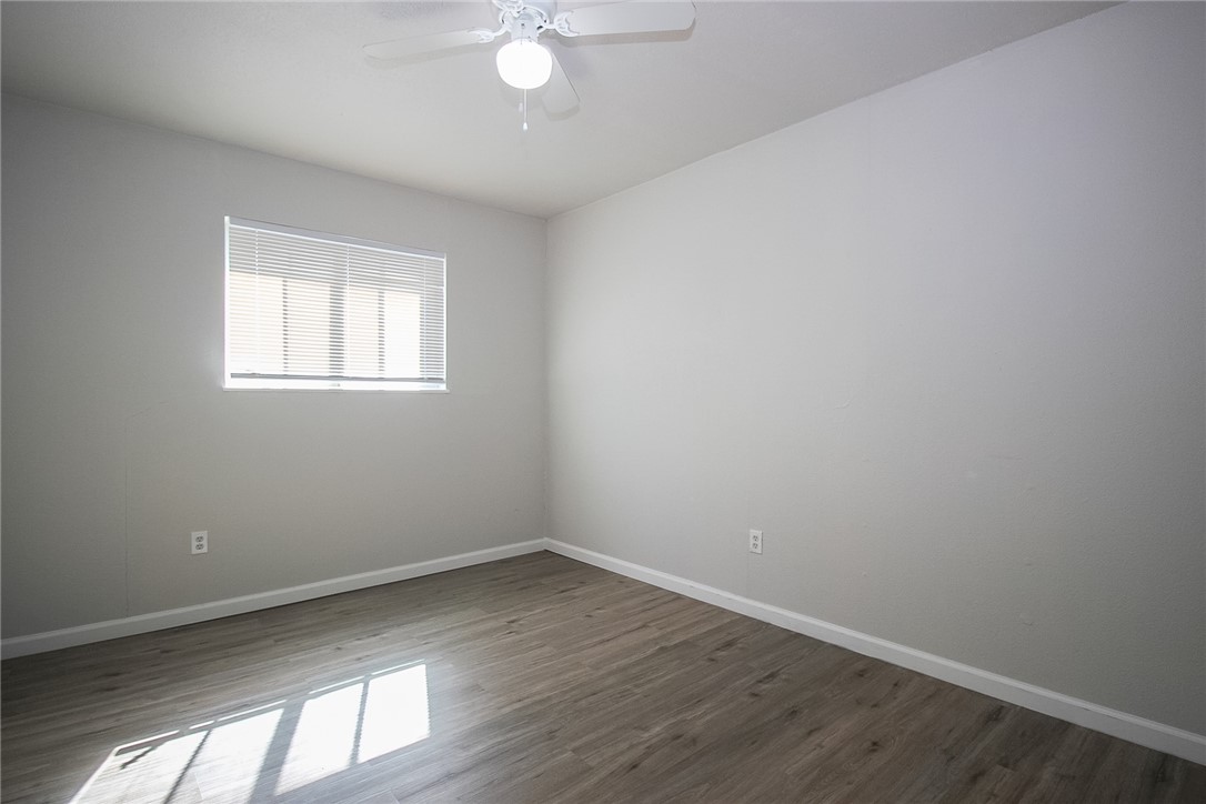 3720 Wingate Drive Waco, TX 76706 - Photo 16 of 18 an empty room with wooden floor and windows
