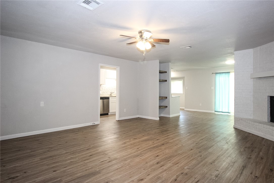 3720 Wingate Drive Waco, TX 76706 - Photo 3 of 18 a view of an empty room with window and wooden floor