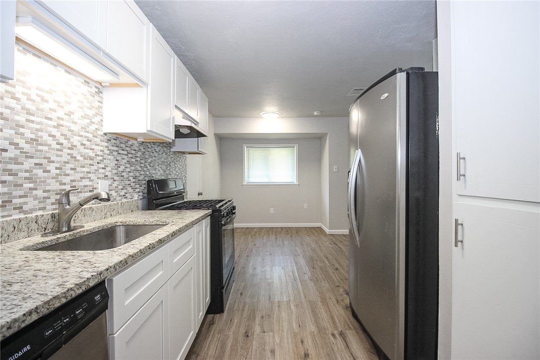 3720 Wingate Drive Waco, TX 76706 - Photo 6 of 18 a kitchen with a sink cabinets stainless steel appliances and a window