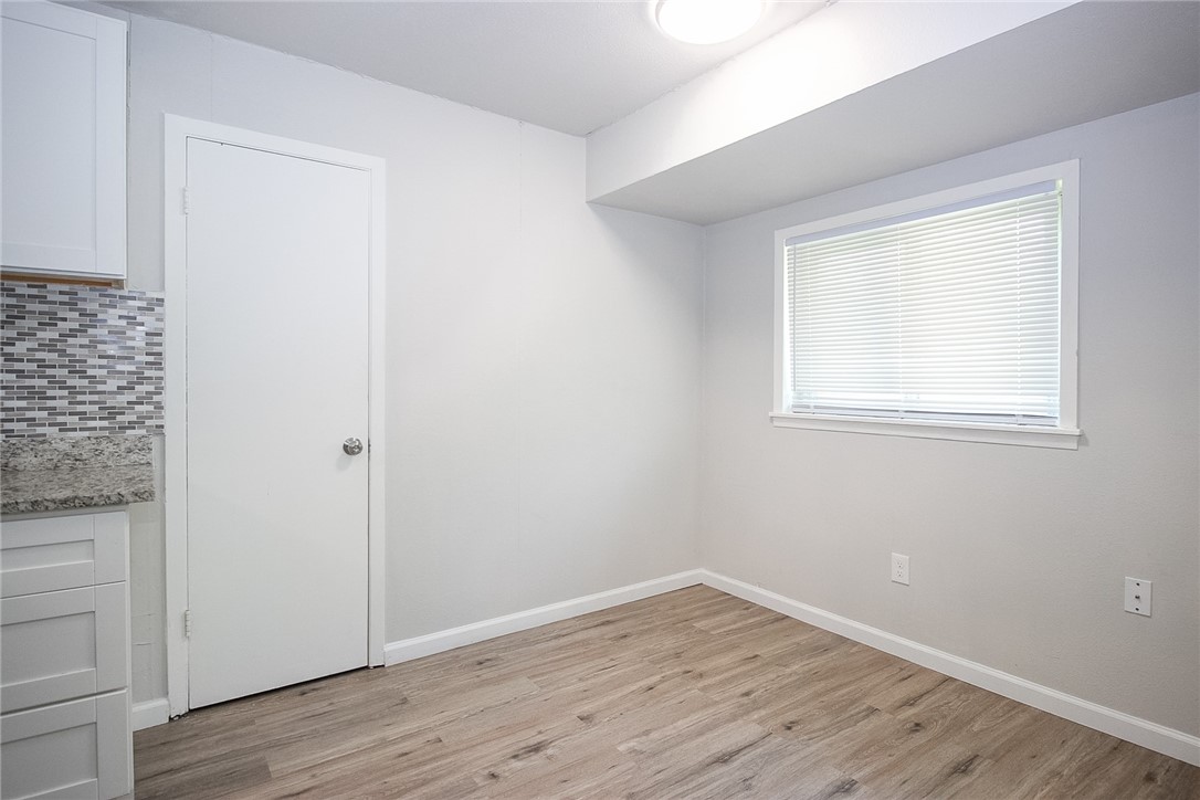 3720 Wingate Drive Waco, TX 76706 - Photo 7 of 18 an empty room with wooden floor and windows