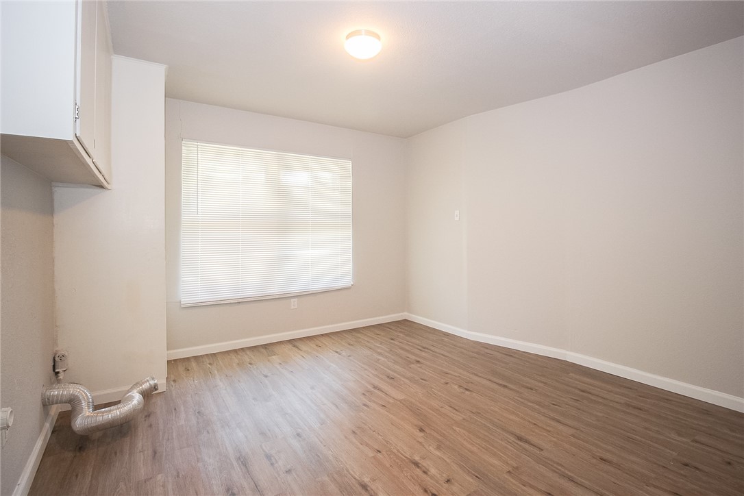 3720 Wingate Drive Waco, TX 76706 - Photo 10 of 18 an empty room with wooden floor and windows