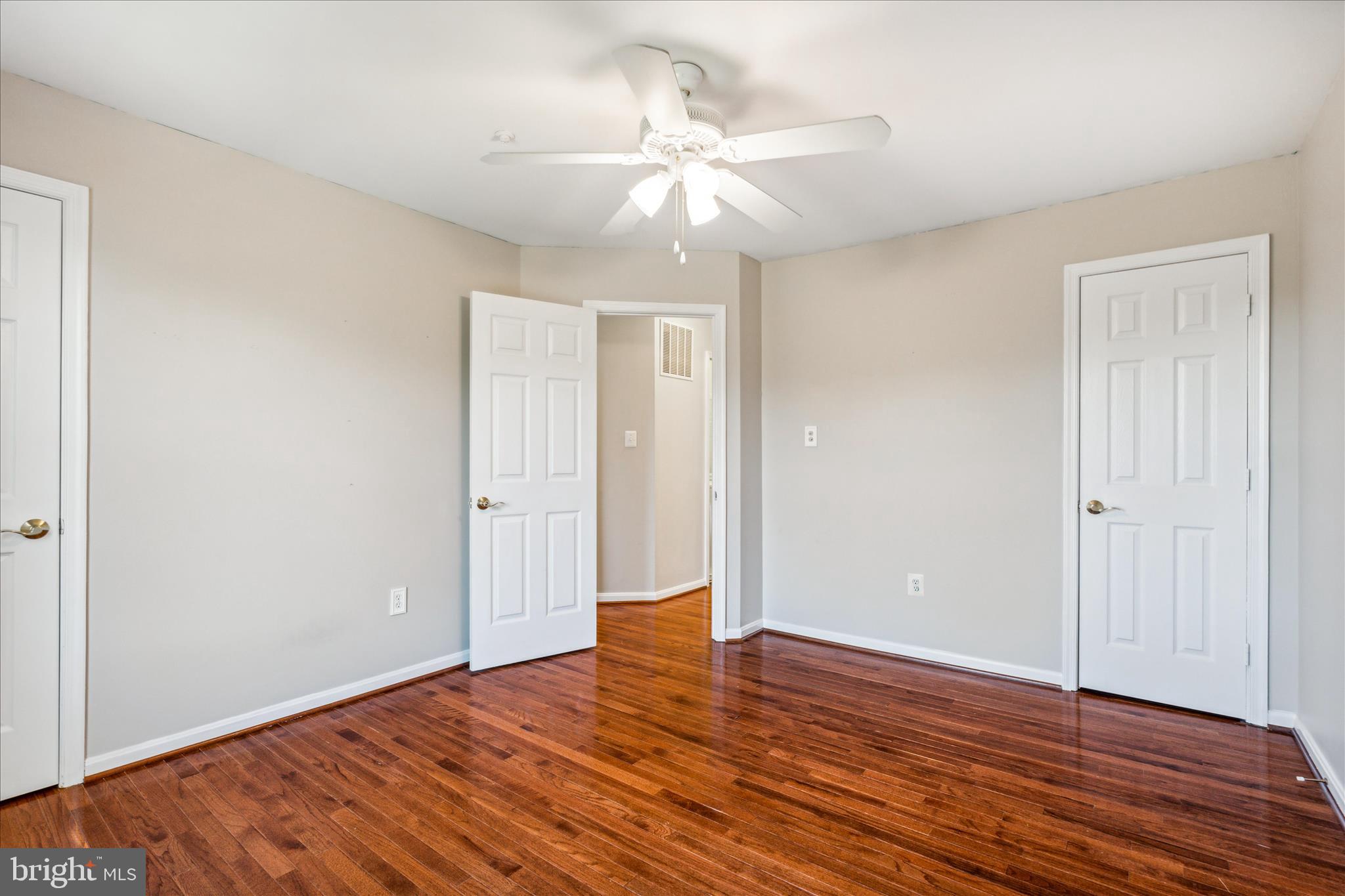 2442 Rippling Brook Road Frederick, MD 21701 - Photo 42 of 85 a view of an empty room with wooden floor