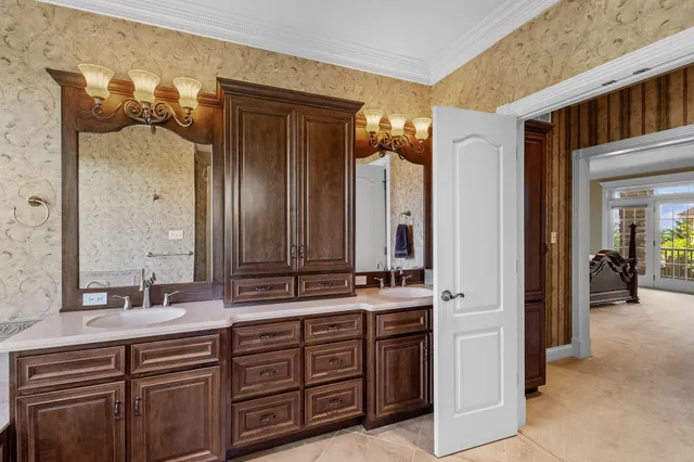 a bathroom with a double vanity sink and a mirror