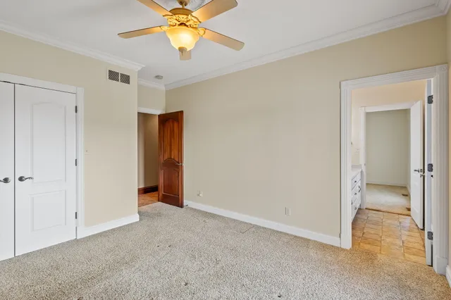 a view of a hallway with closet and entryway