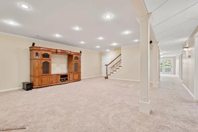 a kitchen with stainless steel appliances granite countertop a sink a stove and a refrigerator