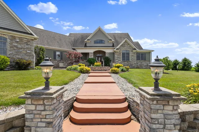 a front view of a house with garden