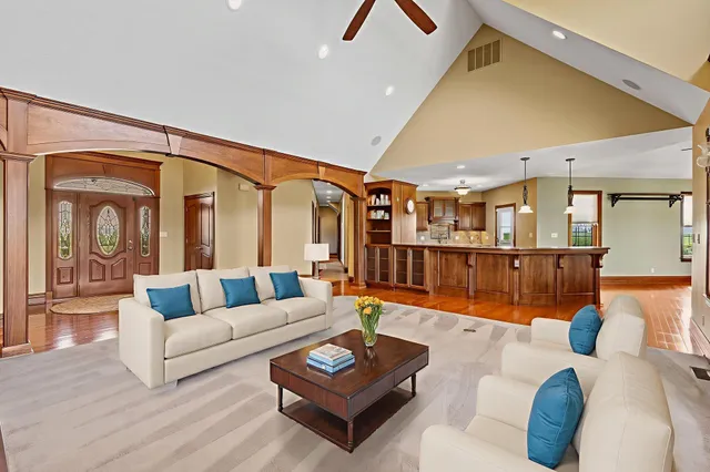 a living room with furniture and a table