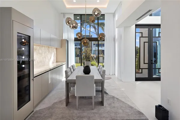 a kitchen with stainless steel appliances a refrigerator and cabinets