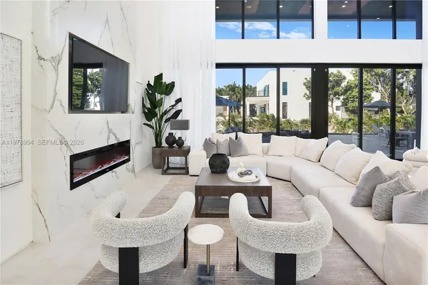 a living room with furniture and a large window