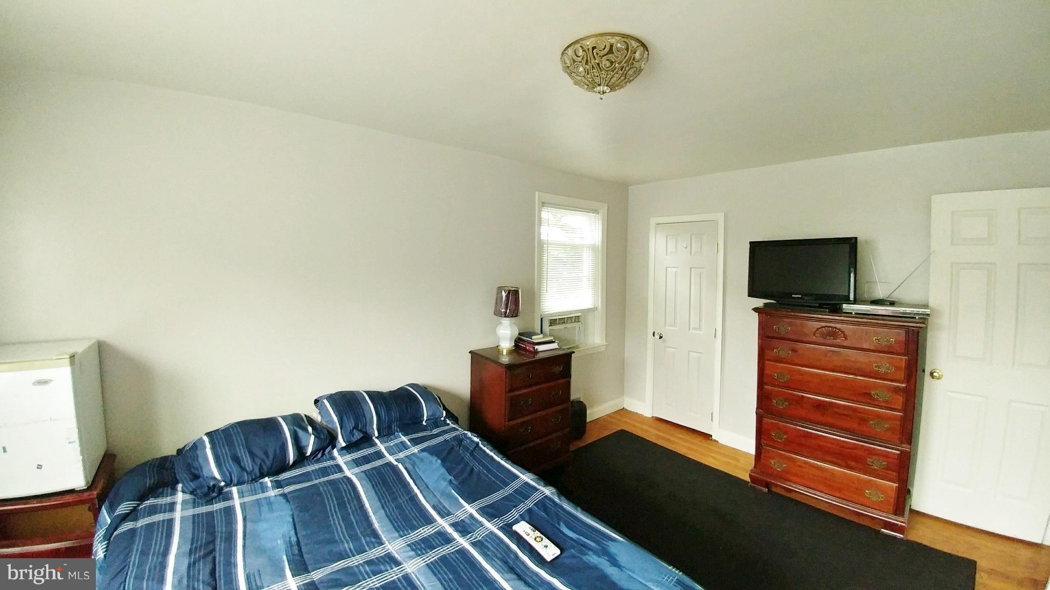 1600 Ingram Road Baltimore, MD 21239 - Photo 22 of 30 a living room with furniture and a flat screen tv