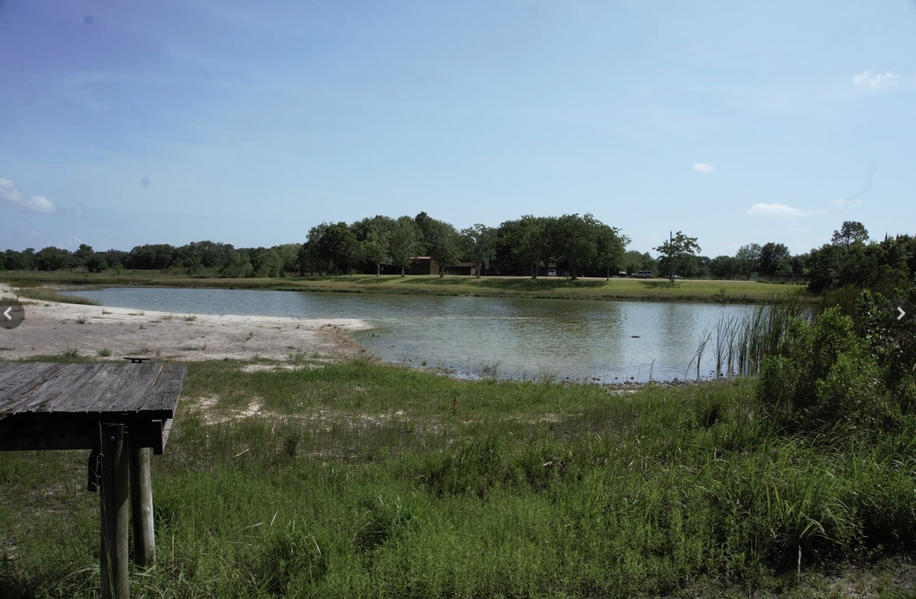 Tbd Robin Lane Bay City, TX 77414 - Photo 2 of 5 a view of a lake next to a lake with houses in the back