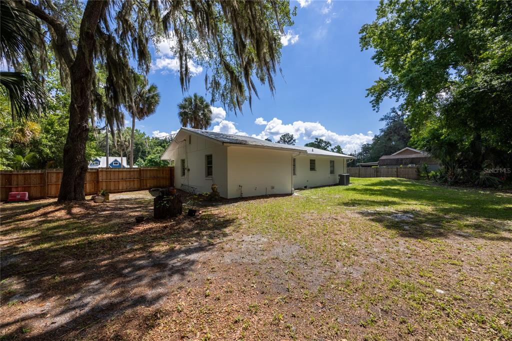 113 Browns Road San Mateo, FL 32187 - Photo 31 of 36 a view of a house with a yard and tree s