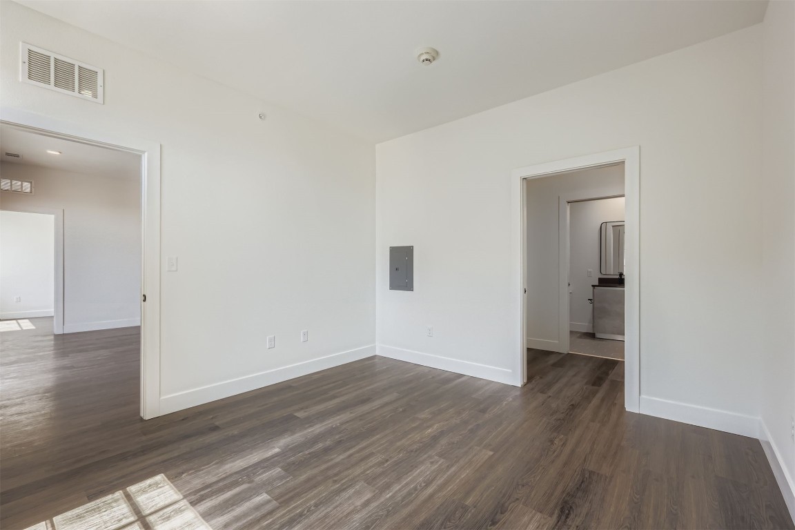 4315 South Congress Avenue, Unit 305 Austin, TX 78745 - Photo 7 of 14 a view of a room with wooden floor and a bathroom