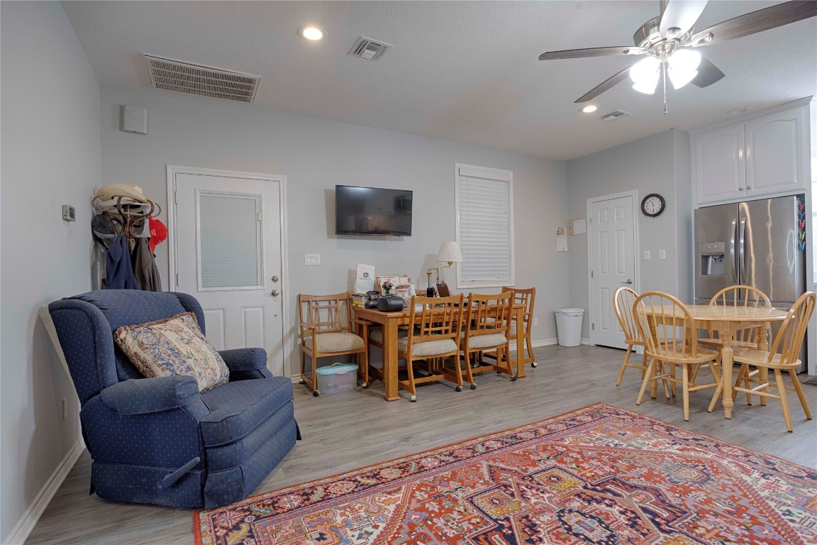 66 County Road 77D Schulenburg, TX 78956 - Photo 22 of 31 a living room with furniture a rug and a flat screen tv