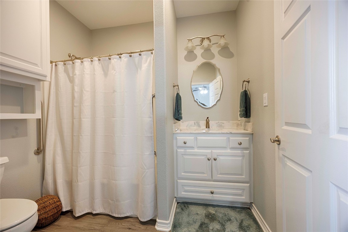 66 County Road 77D Schulenburg, TX 78956 - Photo 28 of 31 a bathroom with a sink a toilet and a mirror