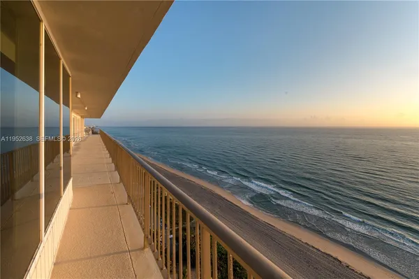 a view of balcony with furniture