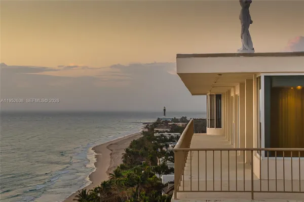 a view of ocean with a multi story building