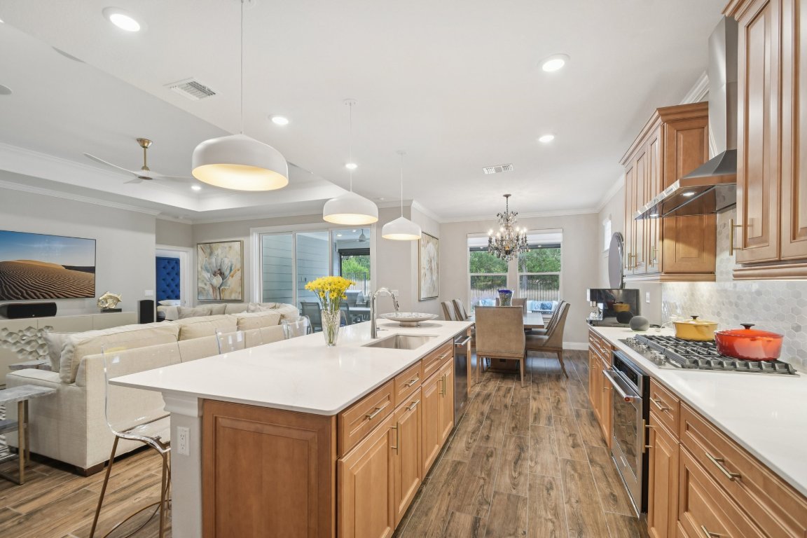 309 Kitty Hawk Road Georgetown, TX 78633 - Photo 17 of 37 a kitchen with a sink stove and cabinets