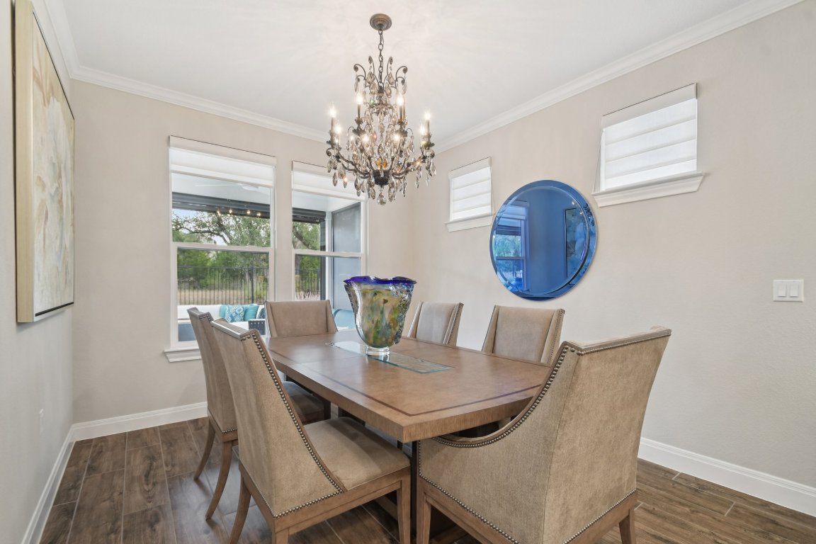 309 Kitty Hawk Road Georgetown, TX 78633 - Photo 18 of 37 a view of a dining room with furniture window and wooden floor